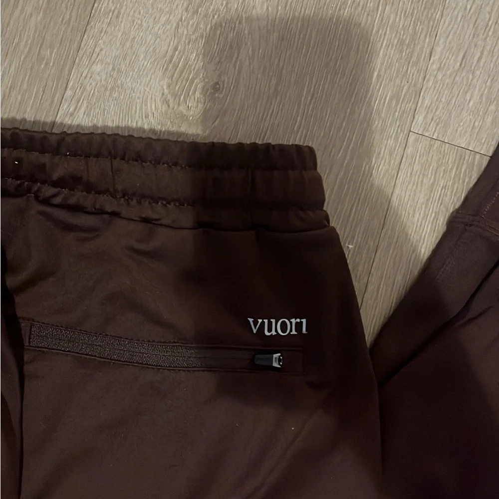 Vuori Men's Sunday Performance Joggers in a brown/oxblood color. - Picture 2 of 5